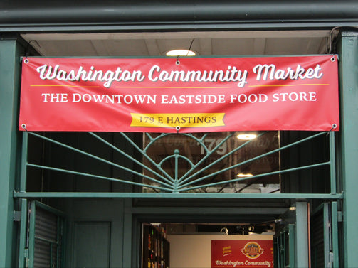 Red Banner with Washington Community Market above entrance